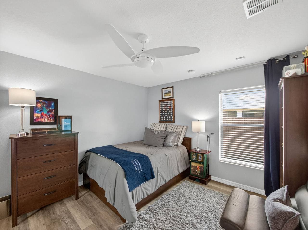 Bedroom with guitars and sports memorabilia