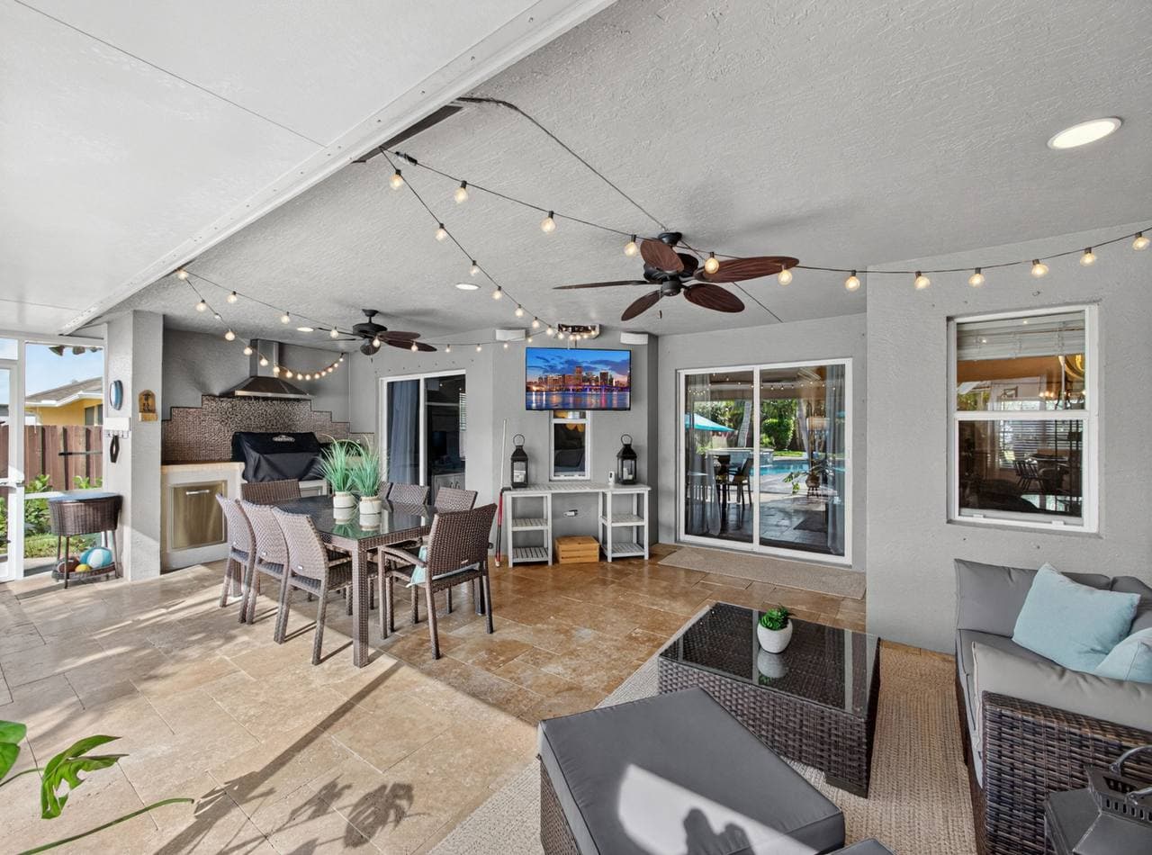 Patio lounge with outdoor TV and grill